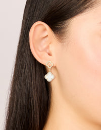 These beautifully crafted gold plated floral earrings feature cubic zirconia accents with pink inlay on ear view - link has visual effect only