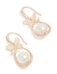 Showcasing dainty butterfly charm oval hook earrings with white pearls, floral pattern, and cubic zirconia in rose gold plated finish front view - link has visual effect only