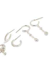 Crafted from silver plated brass, these dainty double rondell huggies and stud earrings in a 4-pack with crystal accents post detail view - link has visual effect only