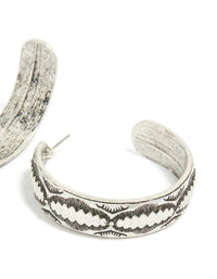 Beautiful antique silver textured hoop earrings highlighting the earring clasp mechanism in post detail view - link has visual effect only