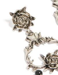 Elegant rose drop earrings with floral, beaded and charm details in silver and black statement style close up view - link has visual effect only