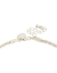 Capturing a silver necklace with black diamante cross pendant clasp detail view - link has visual effect only
