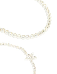 Designed with silver diamante flower and chain bracelets 4-pack with floral feature in statement closure detail view - link has visual effect only