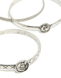 Showcasing silver textured and plain bangles 6-pack with bird, celestial and heart detail in close up view - link has visual effect only