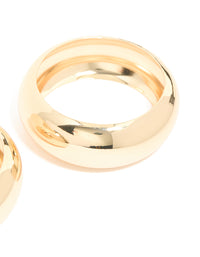 Featuring a 2-pack of gold oversized chunky statement bangles close up view - link has visual effect only