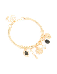 Displaying a gold heart and black stone charm bracelet featuring balls, coin and pearl details front view - link has visual effect only