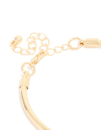Highlighting the gold heart and black stone charm bracelet with balls, coin and pearl features in closure detail view - link has visual effect only