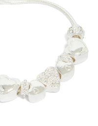 Crafted with silver diamante heart charm and balls designed with toggle closure close up view - link has visual effect only