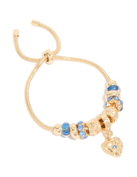 Discover a gold blue diamante and molten heart charm toggle bracelet featuring beaded with balls craftsmanship front view - link has visual effect only
