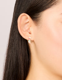 Crafted from gold enamel floral thick huggie earrings featuring chunky design with pink, red, and green pattern on ear view - link has visual effect only