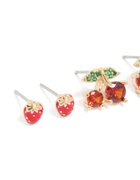Crafted from gold, these strawberry and cherries earrings 3-pack feature fruit, leaf, pearl details with stud closure in red, green, and white close up view - link has visual effect only