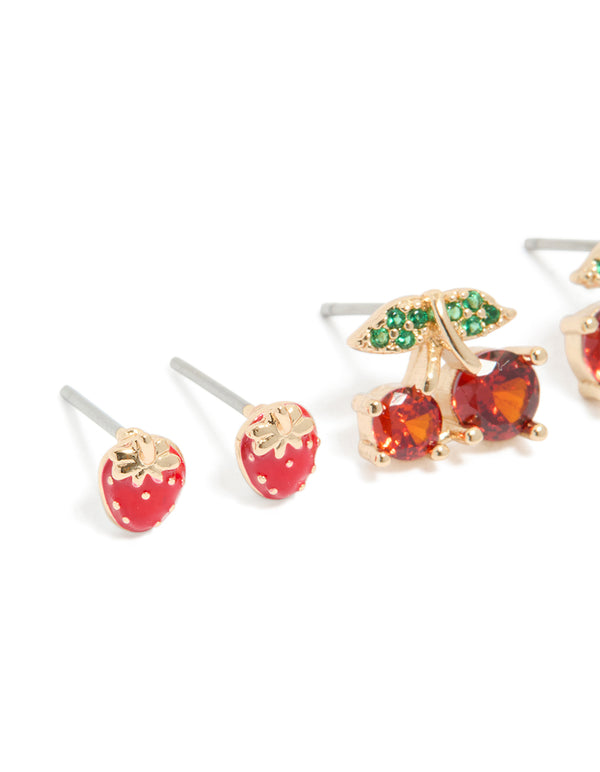 Crafted from gold, these strawberry and cherries earrings 3-pack feature fruit, leaf, pearl details with stud closure in red, green, and white close up view