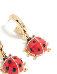 Shop gold ladybug huggie earrings featuring red and black accents post detail view - link has visual effect only