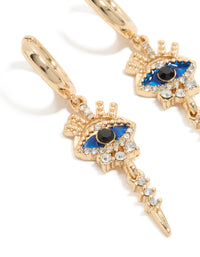 Featuring gold diamante evil eye huggie earrings in blue and black close up view - link has visual effect only