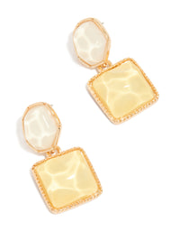 Showcasing statement drop earrings in gold with organic yellow and neutral pool effect featuring round and square shapes front view - link has visual effect only