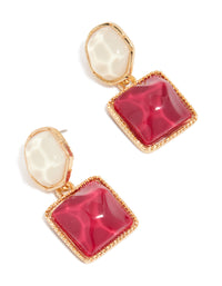 Showcasing statement drop earrings with organic red pool effect round and square charms in gold front view - link has visual effect only