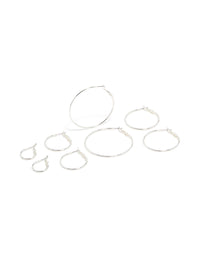 Crafted from silver plated material, these fine thin hoop earrings come in a 4-pack with closure featuring hoop design front view - link has visual effect only