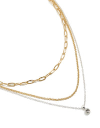Presenting a mixed metal layered necklace with paperclip chain, diamante accents in gold and silver plated finish close up view - link has visual effect only