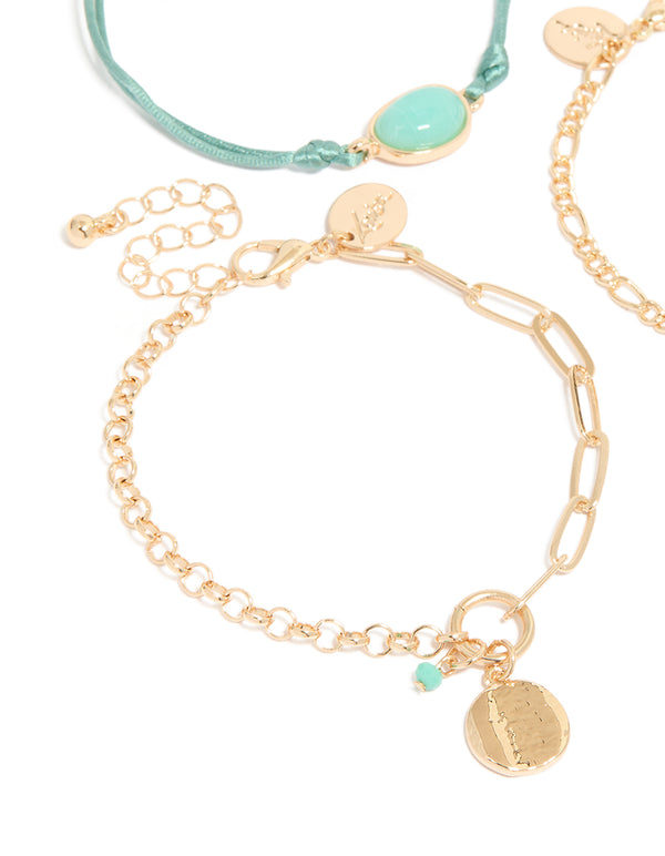 Showcasing a gold turquoise stone bangle and cord bracelets 4-pack with coin details close up view