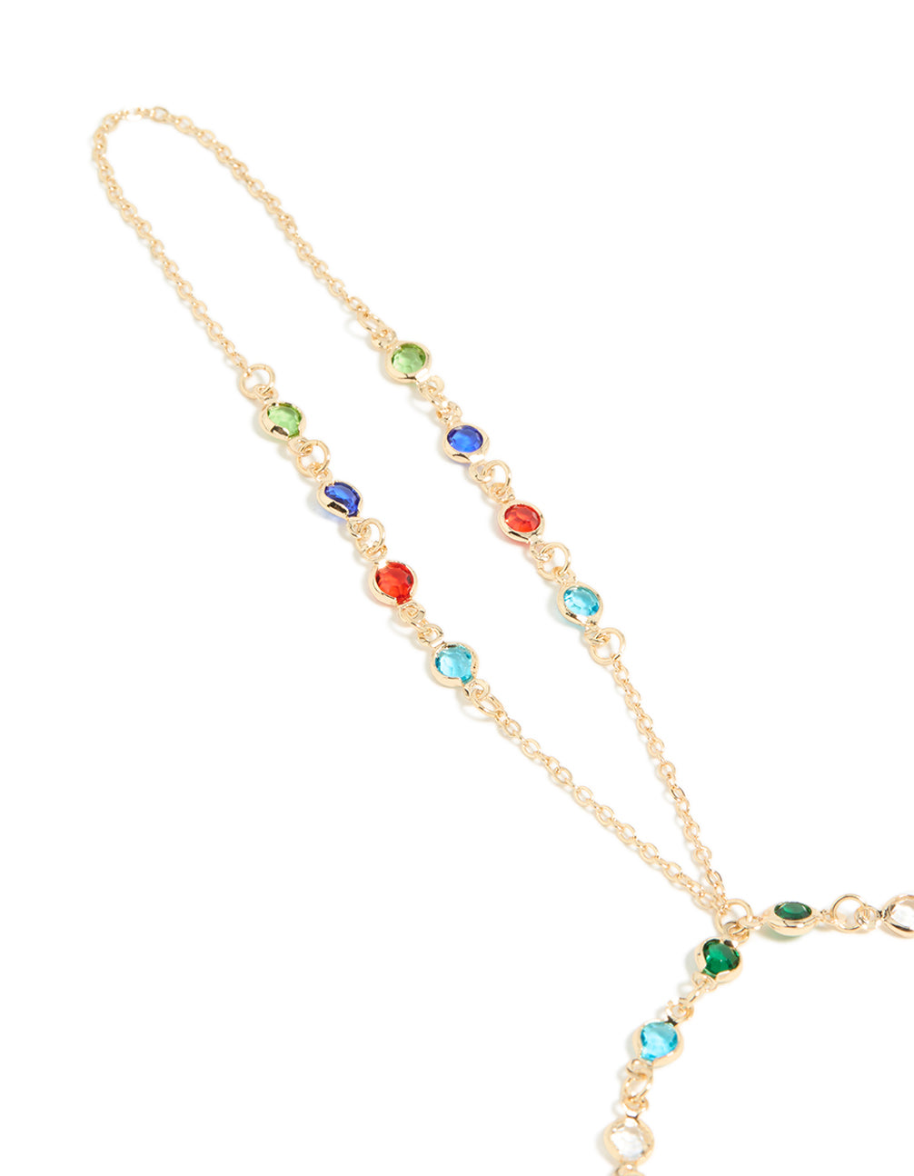 Beautifully crafted statement hand chain in multicolor diamantes featuring green, red, and blue stones close up view