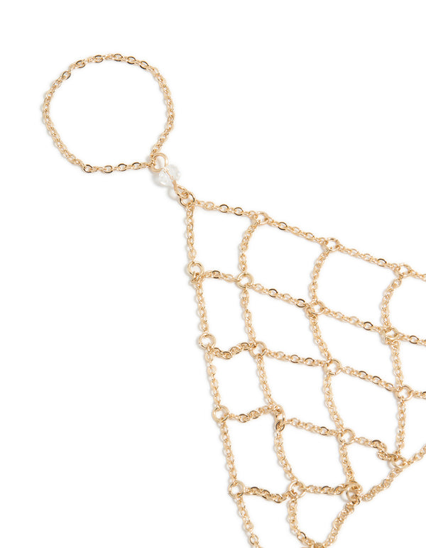 Featuring a statement gold mesh hand chain bracelet with close up view