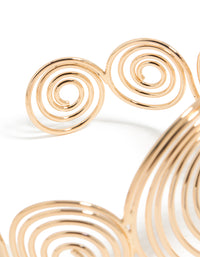 Crafted in gold, this multi swirl arm cuff bangle showcases statement styling closure detail view - link has visual effect only