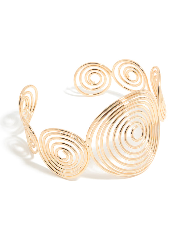 Discover this gold multi swirl arm cuff bangle with statement styling front view