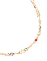 Discover a gold embellished waisted belt with red lime green and skyblue stones detail view - link has visual effect only