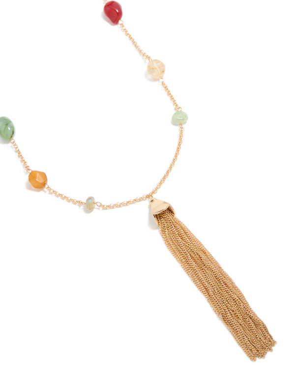 Beautifully crafted beaded, tassel statement necklace in gold with multicoloured drop design close up view