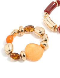 Detailed view of beaded stretch bracelets in a 2-pack with irregular acrylic and gold accents in maroon, orange, and peachpuff hues, close up view - link has visual effect only