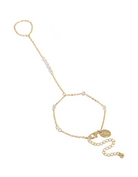 Elegant gold plated floating cubic zirconia hand chain bracelet with beads front view - link has visual effect only