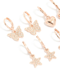 Featuring kids rose gold diamante pavé huggie earrings in a 4-pack with bow, celestial, heart, and butterfly details close up view - link has visual effect only