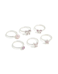Showcasing kids diamante rings featuring bow and butterfly, pearl and star in silver with pearl pink and plum accents front view - link has visual effect only