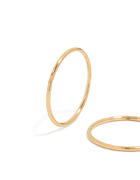 Highlighting 12 MM sleeper hoop earrings crafted from gold plated surgical steel in close up view - link has visual effect only