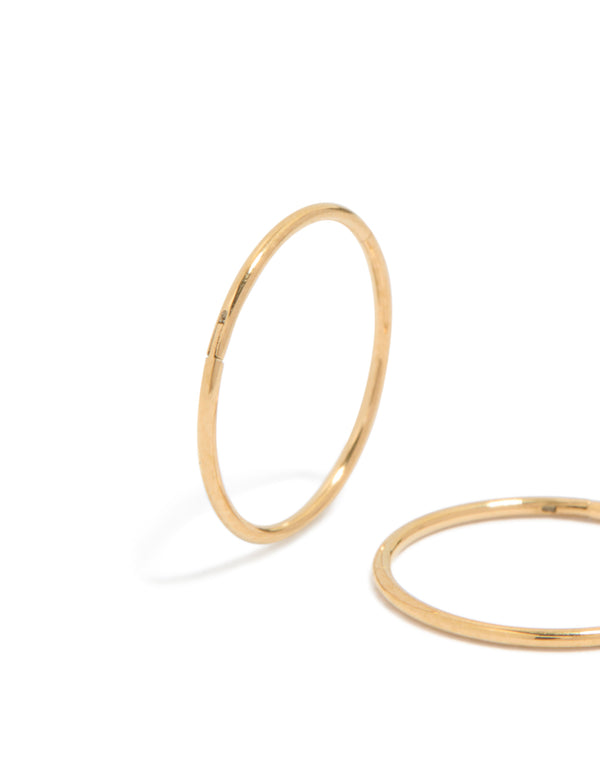 Highlighting 12 MM sleeper hoop earrings crafted from gold plated surgical steel in close up view
