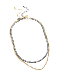 Elegant mixed metal plated cubic zirconia double layered tennis ball chain necklace in gold front view - link has visual effect only