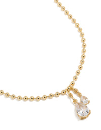 Showcasing a gold plated double cubic zirconia teardrop pendant necklace with ball chain close up view - link has visual effect only