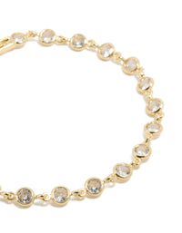 Featuring gold plated bezel cubic zirconia tennis bracelet close up view - link has visual effect only