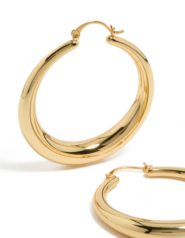 Featuring gold plated thick thin hoop earrings with closure close up view