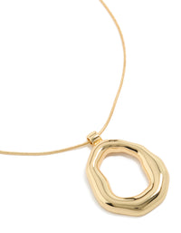 Showcasing a gold plated organic circle pendant necklace close up view - link has visual effect only