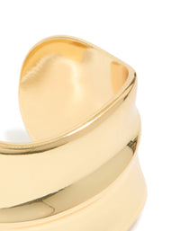 Featuring a gold plated wide organic wrist cuff with statement bangle design close up view - link has visual effect only