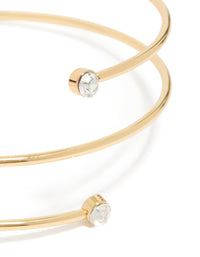 Showcasing a gold plated diamante wrap around arm cuff with statement design close up view - link has visual effect only