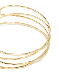 Showcasing gold plated multi cross textured arm cuff with statement design close up view - link has visual effect only