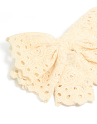 Featuring cornsilk broderie triple layered fabric bow hair clip with floral accents side view - link has visual effect only