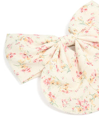 Printed fabric bow clip with floral pattern featuring leaf details in ivory, light pink, peachpuff, and pale green side view - link has visual effect only
