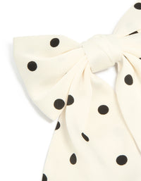 Crafted with white and black polka dot fabric bow hair clip side view - link has visual effect only