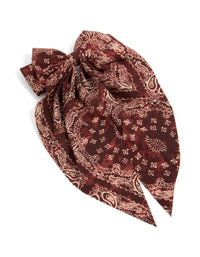 Beautifully crafted bow hair clip featuring paisley print in maroon, brown with statement styling front view - link has visual effect only