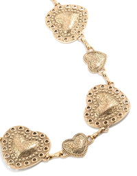 Showcasing an antique gold western heart belt with embellished waisted design in a statement styling detail view - link has visual effect only