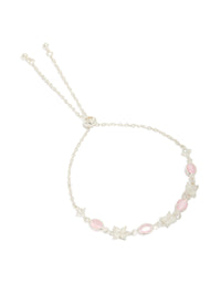 Crafted from silver plated metal, this oval toggle bracelet features floral charms with cubic zirconia accents in pink and clear front view - link has visual effect only