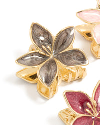Crafted from gold pink burgundy enamel frangipani claw clips in a 4-pack featuring floral design and glitter accents detail view - link has visual effect only
